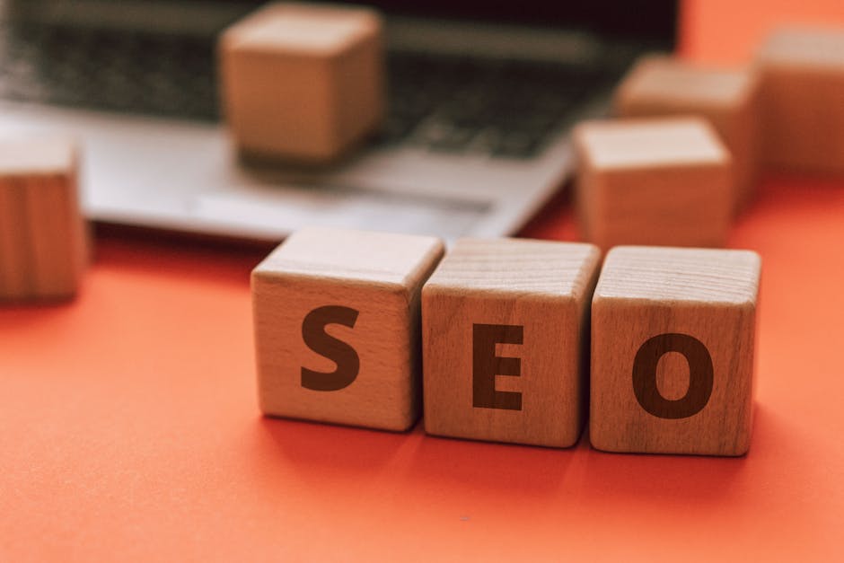 Scrabble tiles spelling 'SEO' on a wooden surface. Ideal for digital marketing themes.